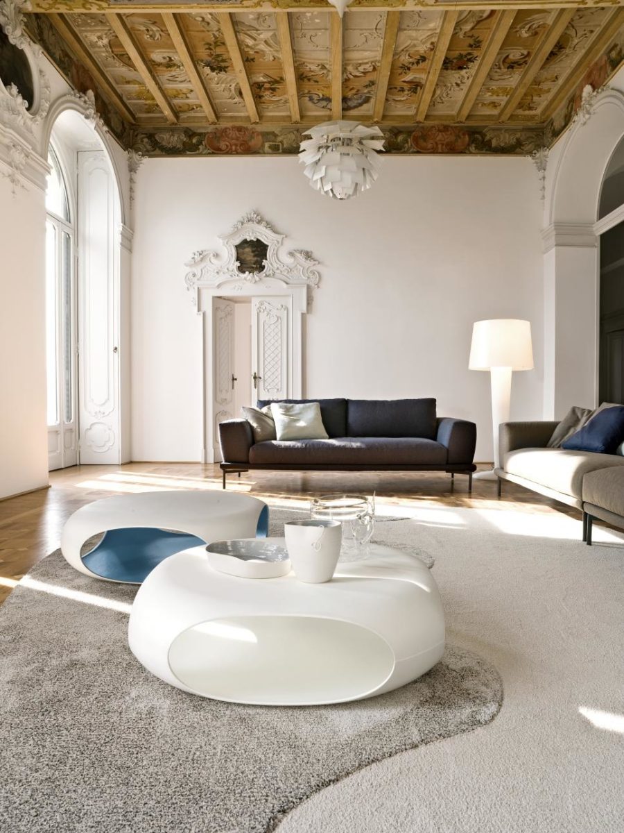 Italian inspired living room with a unique wooden ceiling