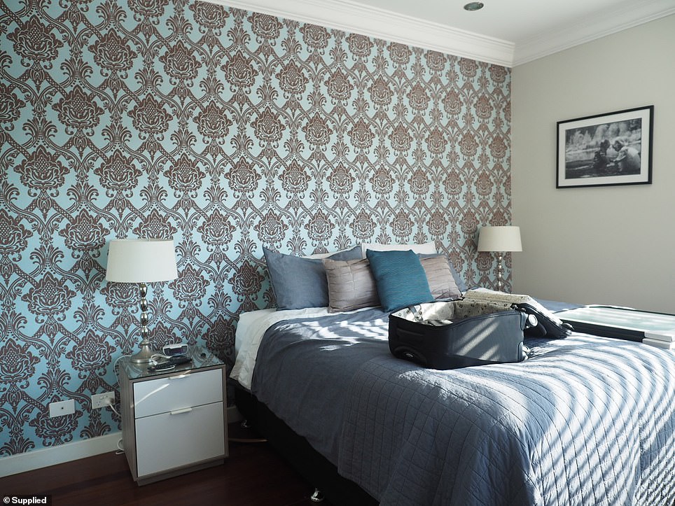 The scatter cushions were blending with the wallpaper in the previous room